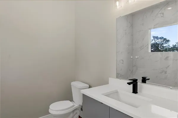 a view of a room with wooden floor and windows