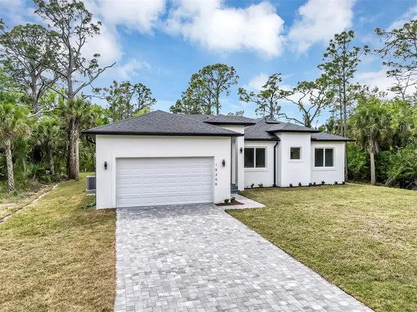 a house with trees in the background