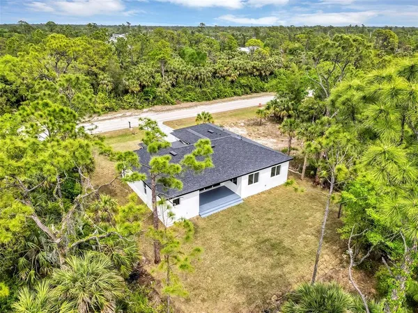 a view of a pathway both side of yard