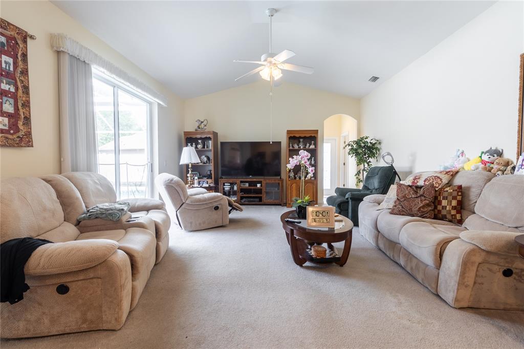 1812 Flower Branch Way Valrico, FL 33594 - Photo 13 of 42 a living room with furniture and a large window