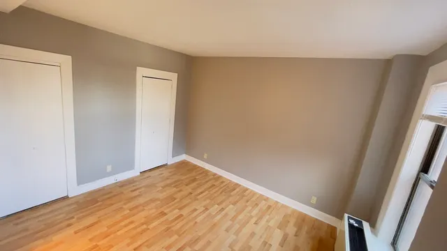 a view of an empty room and window