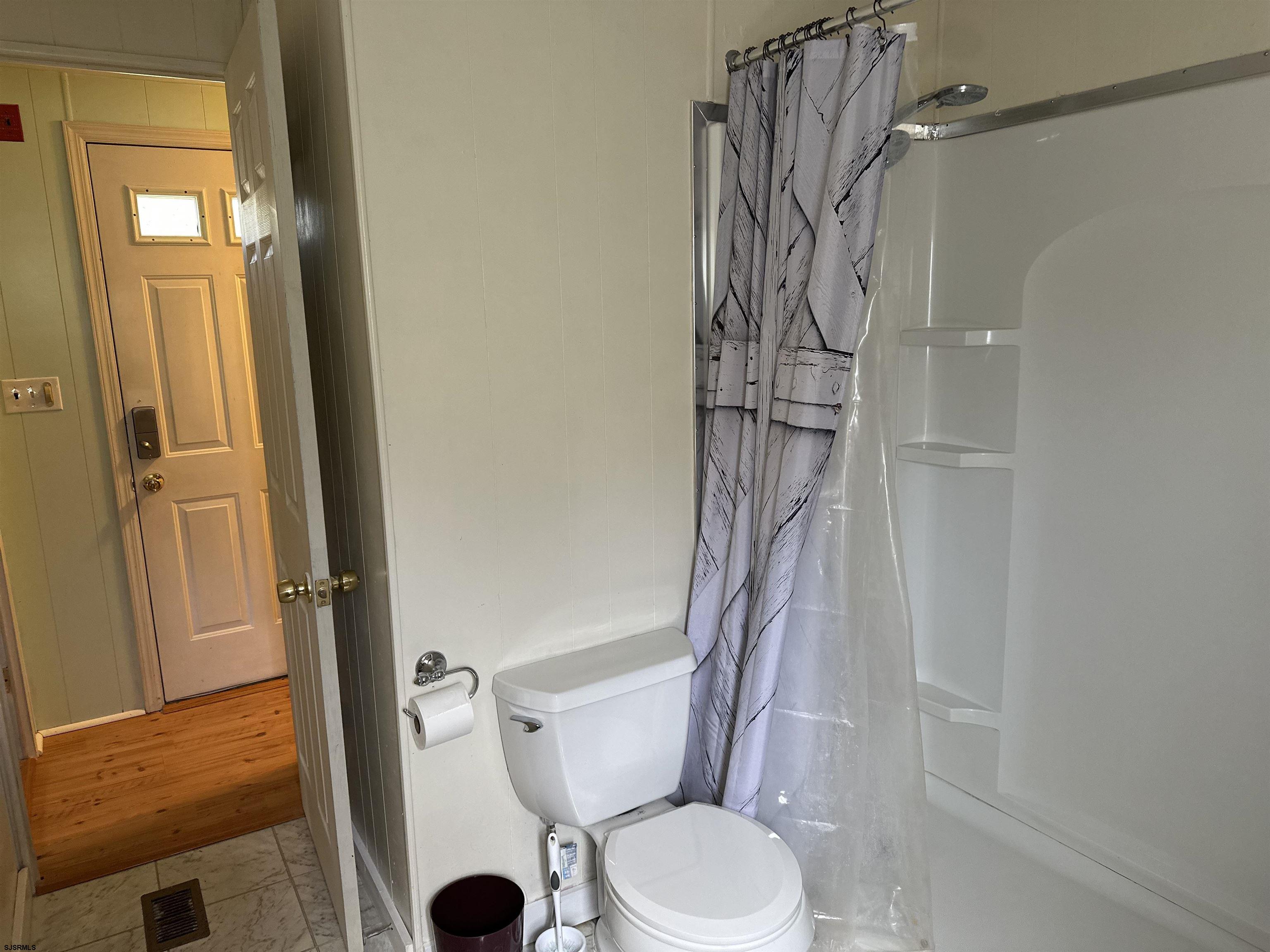 6215 Delilah Road Egg Harbor Township, NJ 08234 - Photo 11 of 18 a bathroom with a shower and a toilet