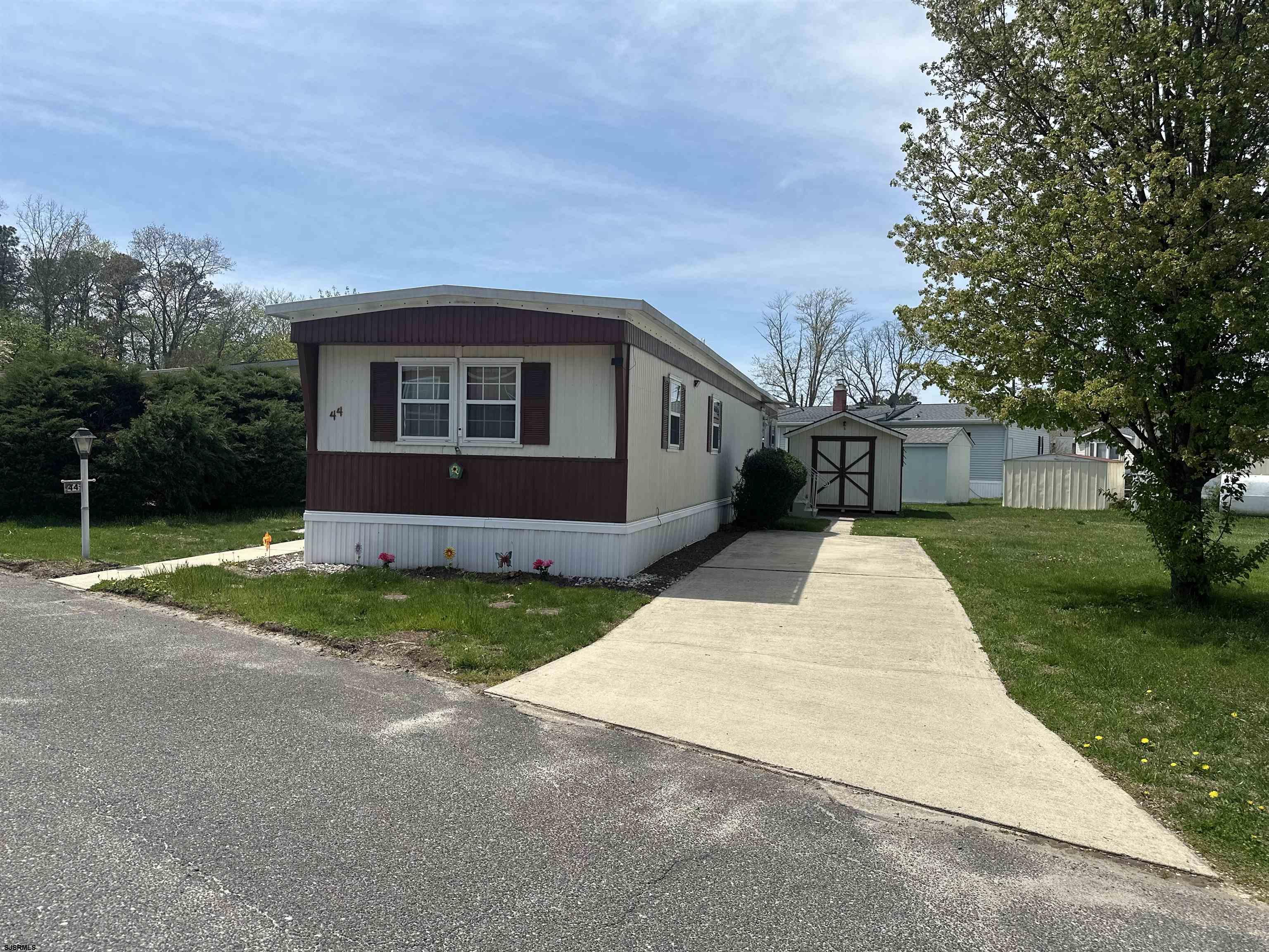 6215 Delilah Road Egg Harbor Township, NJ 08234 - Photo 17 of 18 a front view of a house with yard