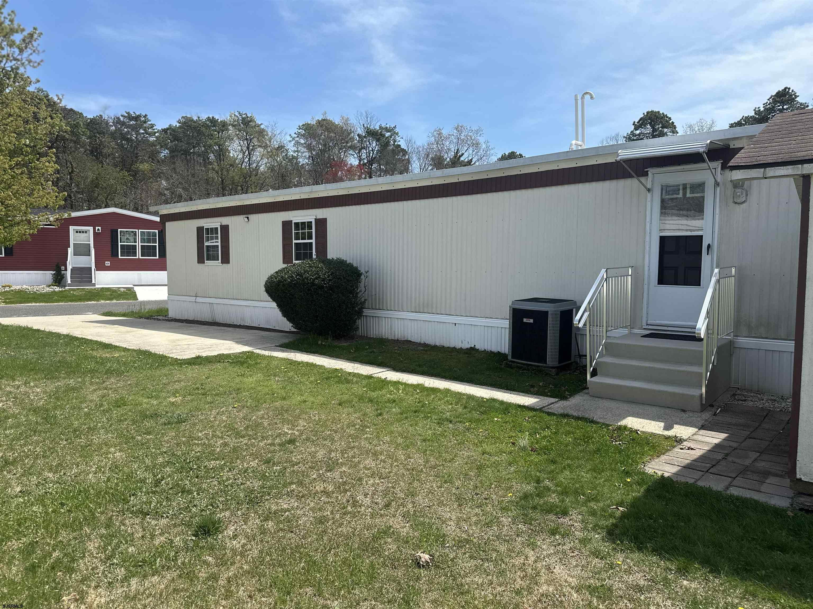 6215 Delilah Road Egg Harbor Township, NJ 08234 - Photo 2 of 18 a backyard of a house with table and chairs