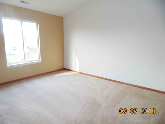 637 Deames Street Plano, IL 60545 - Photo 11 of 18 an empty room with a window