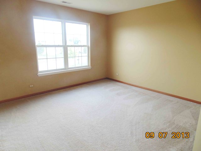 637 Deames Street Plano, IL 60545 - Photo 12 of 18 an empty room with a window