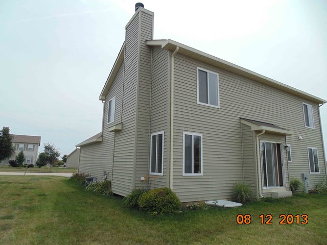 637 Deames Street Plano, IL 60545 - Photo 2 of 18 a view of a house with a yard