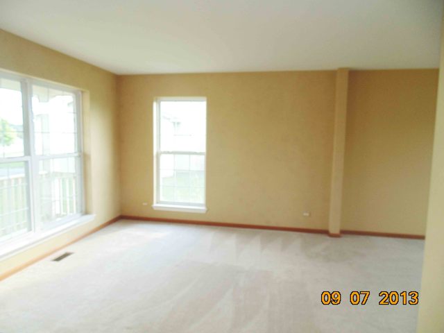 637 Deames Street Plano, IL 60545 - Photo 5 of 18 a view of an empty room with a window