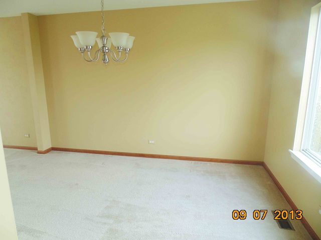 637 Deames Street Plano, IL 60545 - Photo 6 of 18 an empty room with a window