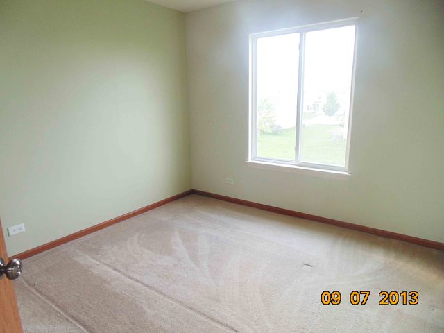 637 Deames Street Plano, IL 60545 - Photo 9 of 18 an empty room with a window