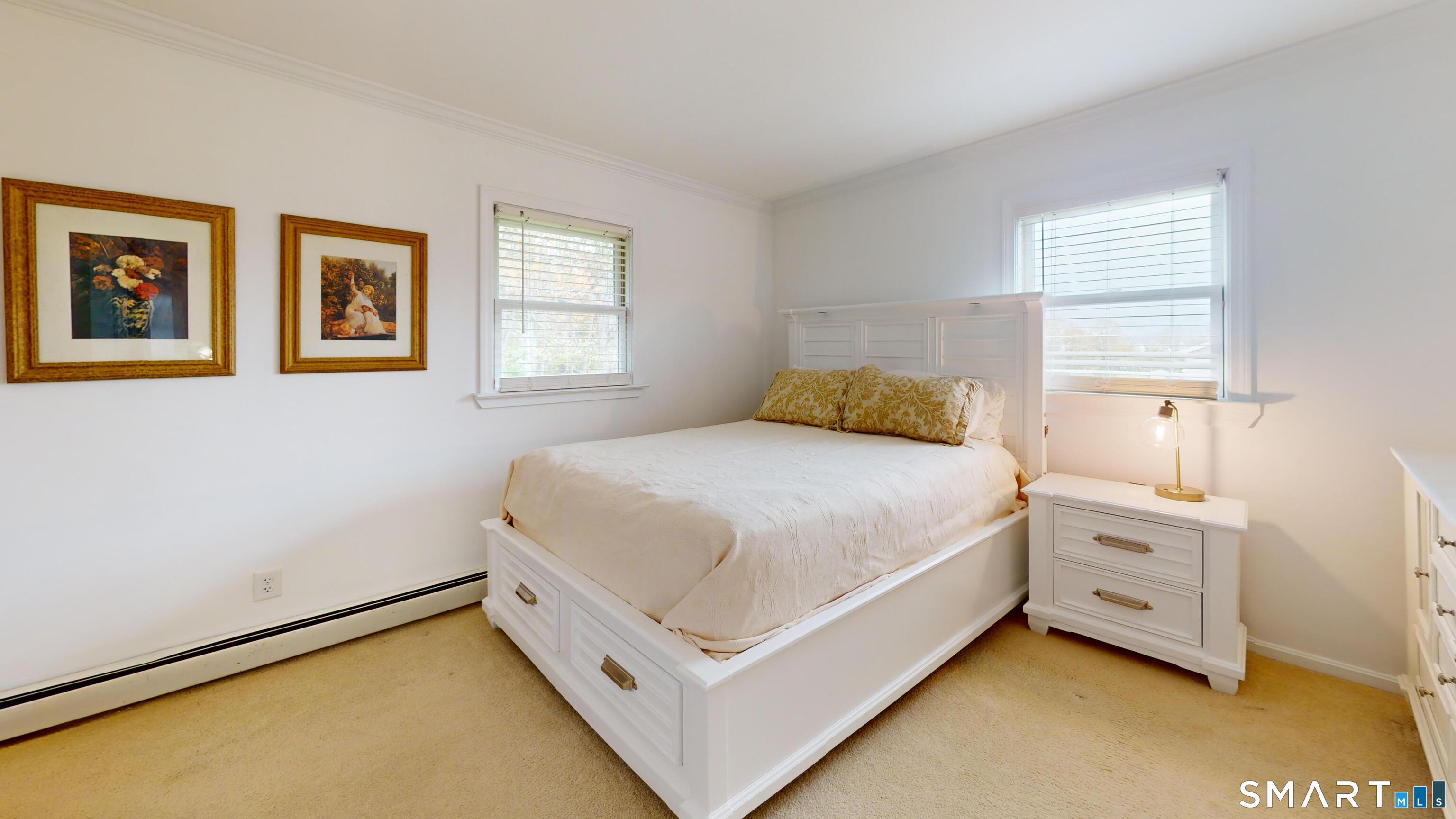 29 Deer Ridge Road Stonington, CT 06378 - Photo 19 of 35 a bedroom with a bed and a window