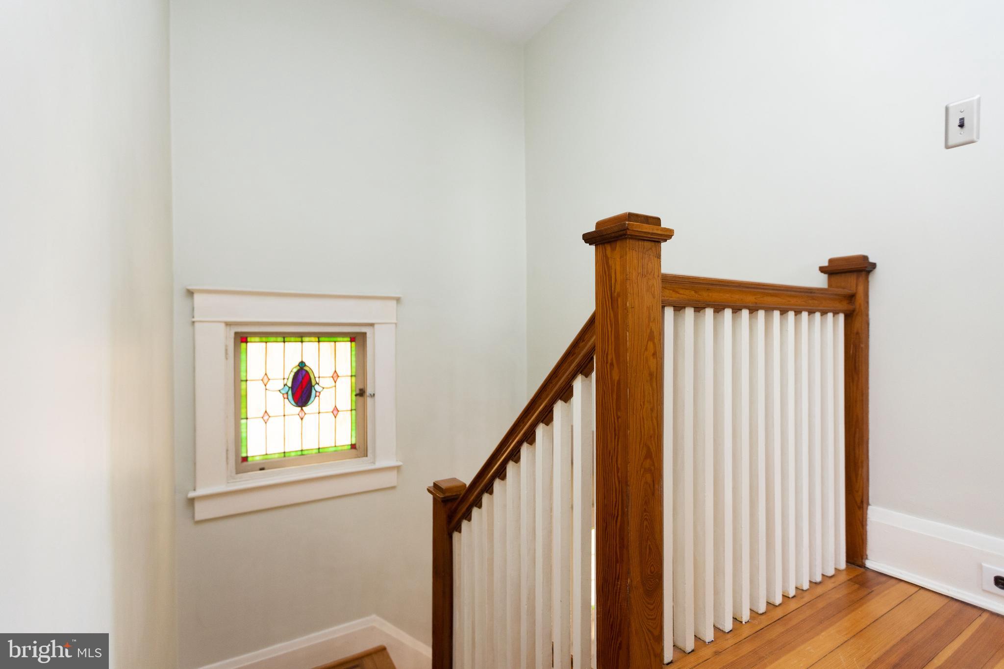 3304 Beverly Road Baltimore, MD 21214 - Photo 17 of 37 Stairs to upper level with stained glass window