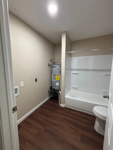 a bathroom with a sink a toilet and a bathtub