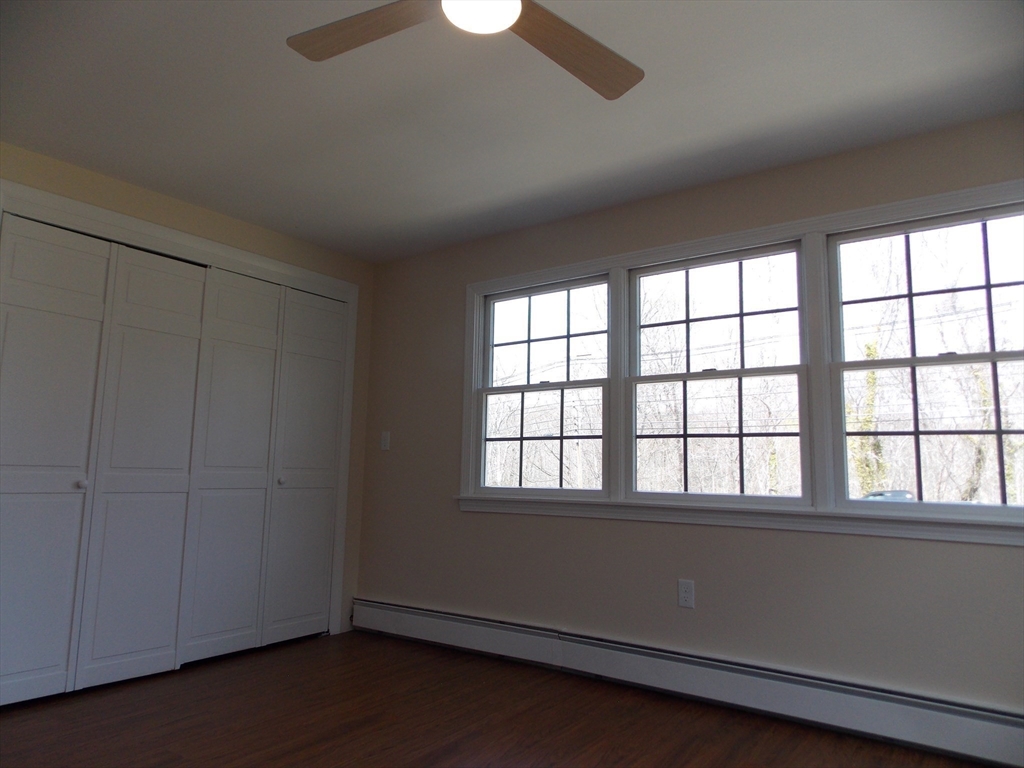 196 Main Street, Unit A Rockport, MA 01966 - Photo 16 of 36 a view of an empty room with a window