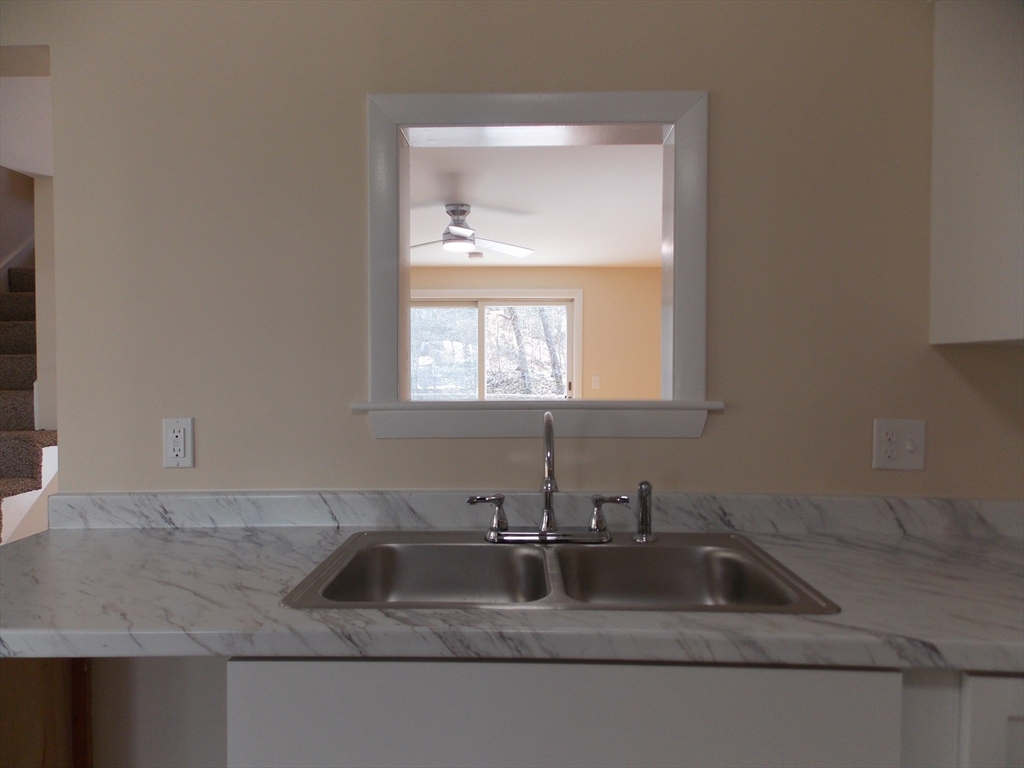 196 Main Street, Unit A Rockport, MA 01966 - Photo 10 of 36 a kitchen with sink and window