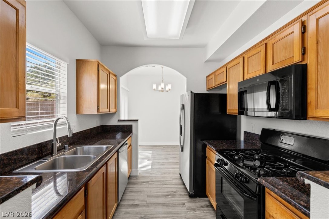 1412 Beaver Spring Street Las Vegas, NV 89128 - Photo 6 of 20 A well-equipped kitchen featuring rich countertops and ample cabinet storage.