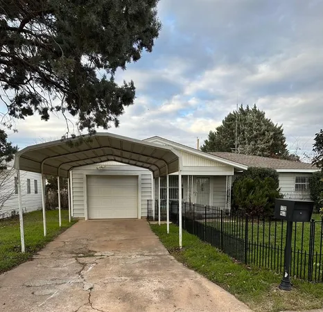 front view of a house with a garden