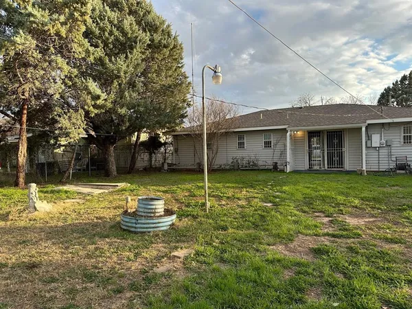 a house with a tree in front of it