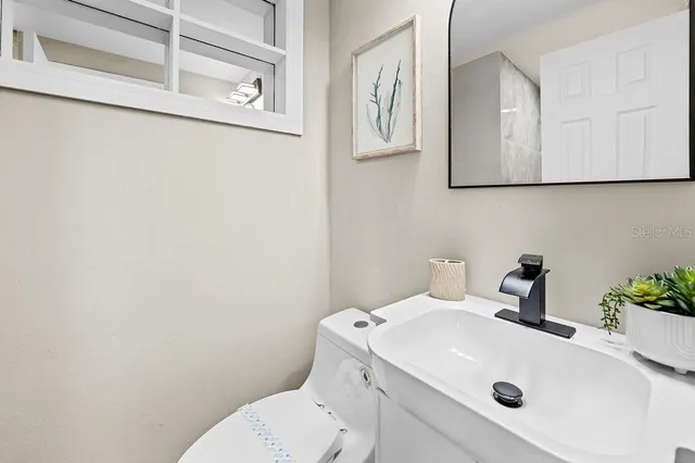 a bathroom with a sink and a toilet
