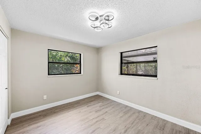 a view of an empty room with a window