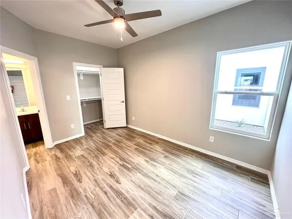 wooden floor in an empty room with a fireplace