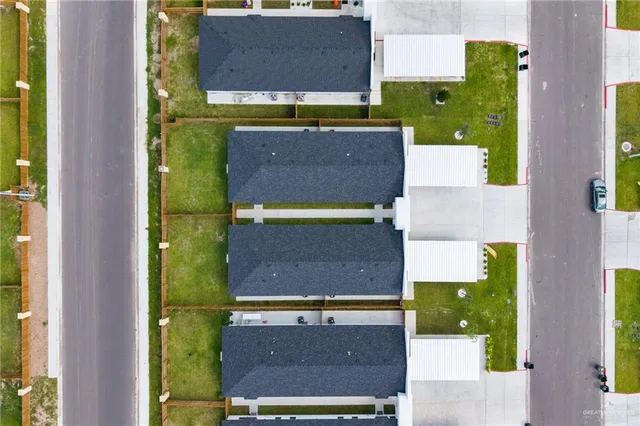 an aerial view of a house with a swimming pool
