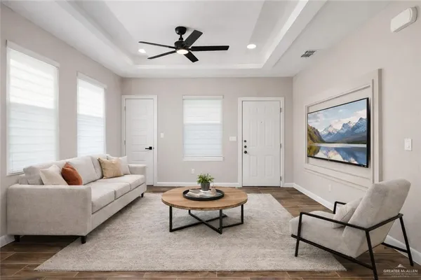 a living room with furniture and a large window