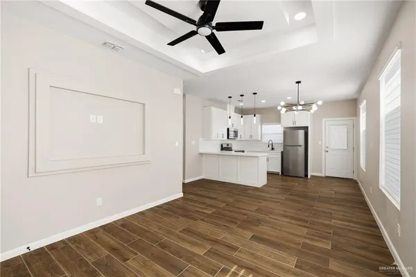 a view of kitchen with wooden floor and window