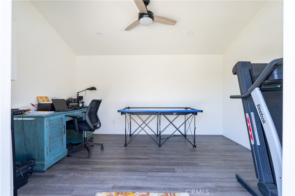 8550 El Corte Road Atascadero, CA 93422 - Photo 54 of 72 a view of a workspace with furniture and wooden floor