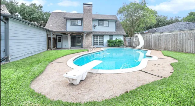 a view of outdoor space yard and swimming pool
