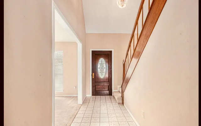 a view of an entryway with a hallway
