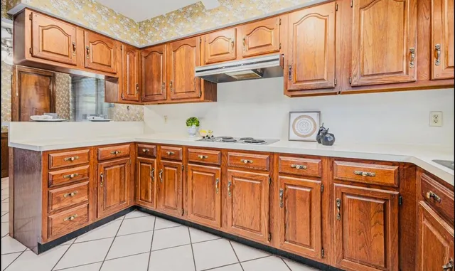 a kitchen with stainless steel appliances granite countertop a sink and cabinets