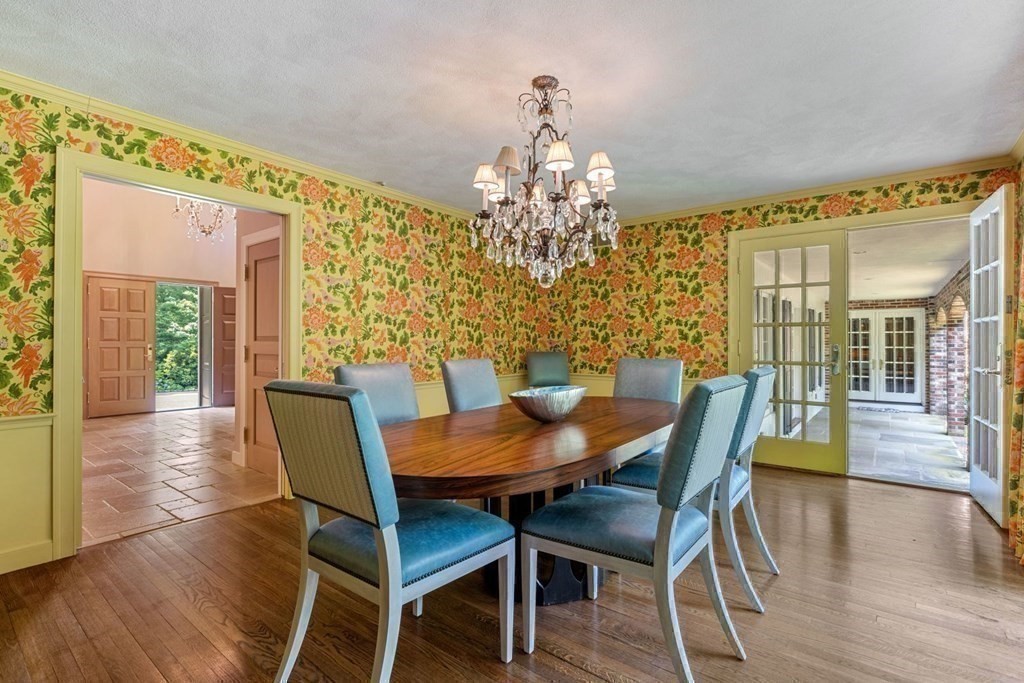 25 Bullard Road Weston, MA 02493 - Photo 13 of 31 a view of a dining room with furniture wooden floor and chandelier