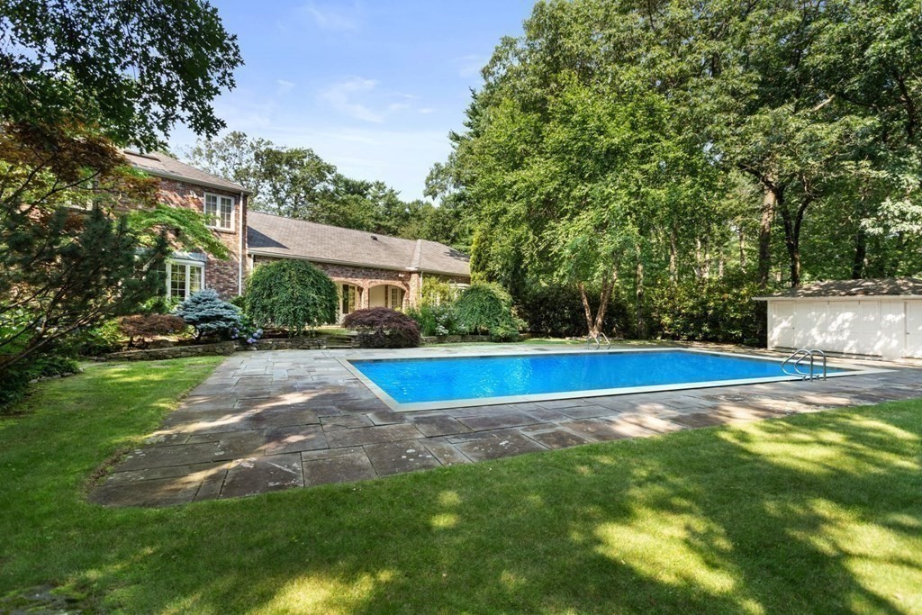 25 Bullard Road Weston, MA 02493 - Photo 27 of 31 a view of a swimming pool and trees in the background