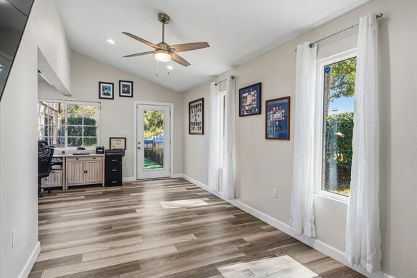 a living room with a fireplace and a flat screen tv