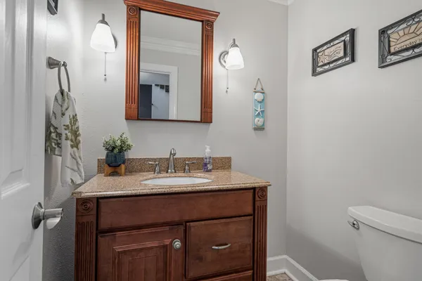 a bathroom with a sink a mirror and shower