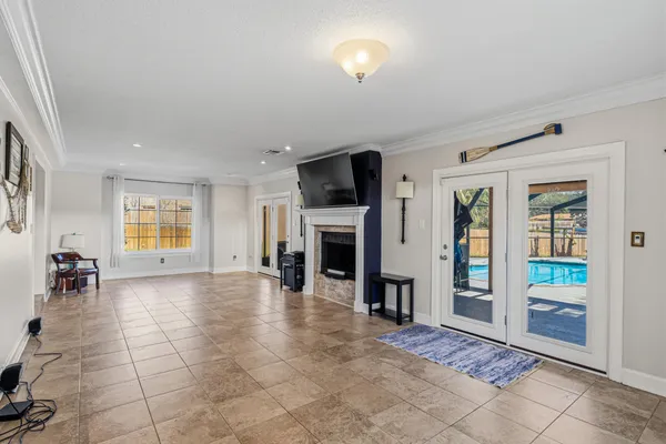 a bedroom with a large bed and a large window
