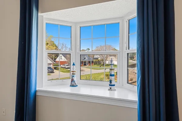 a bathroom with a sink double vanity granite tub and a mirror