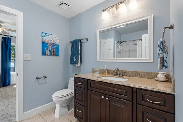 a view of a house with yard and a garden