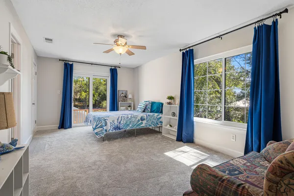 a view of a backyard with swimming pool table and chairs
