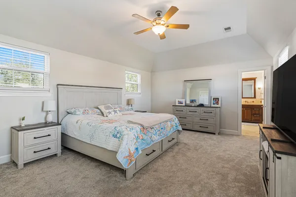 a living room with furniture a rug and a window