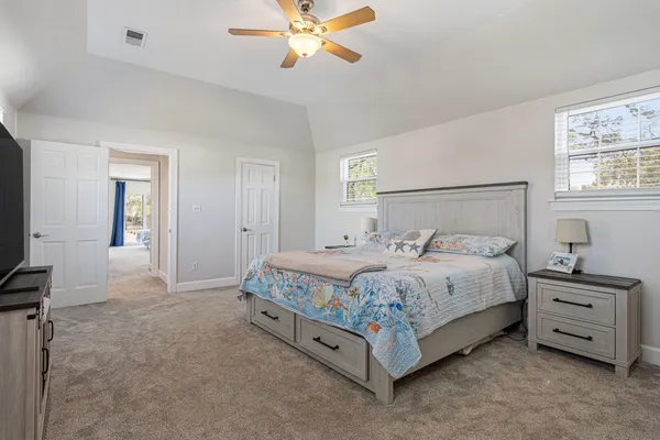 a view of a chair and table in the house front view