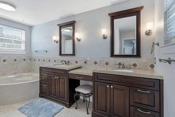 a view of a house with swimming pool and sitting area