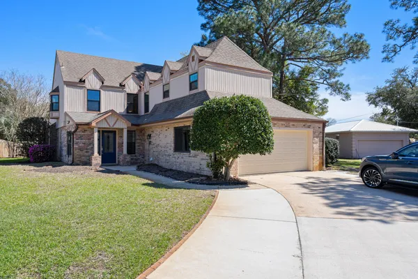 a view of a dining room with furniture and window