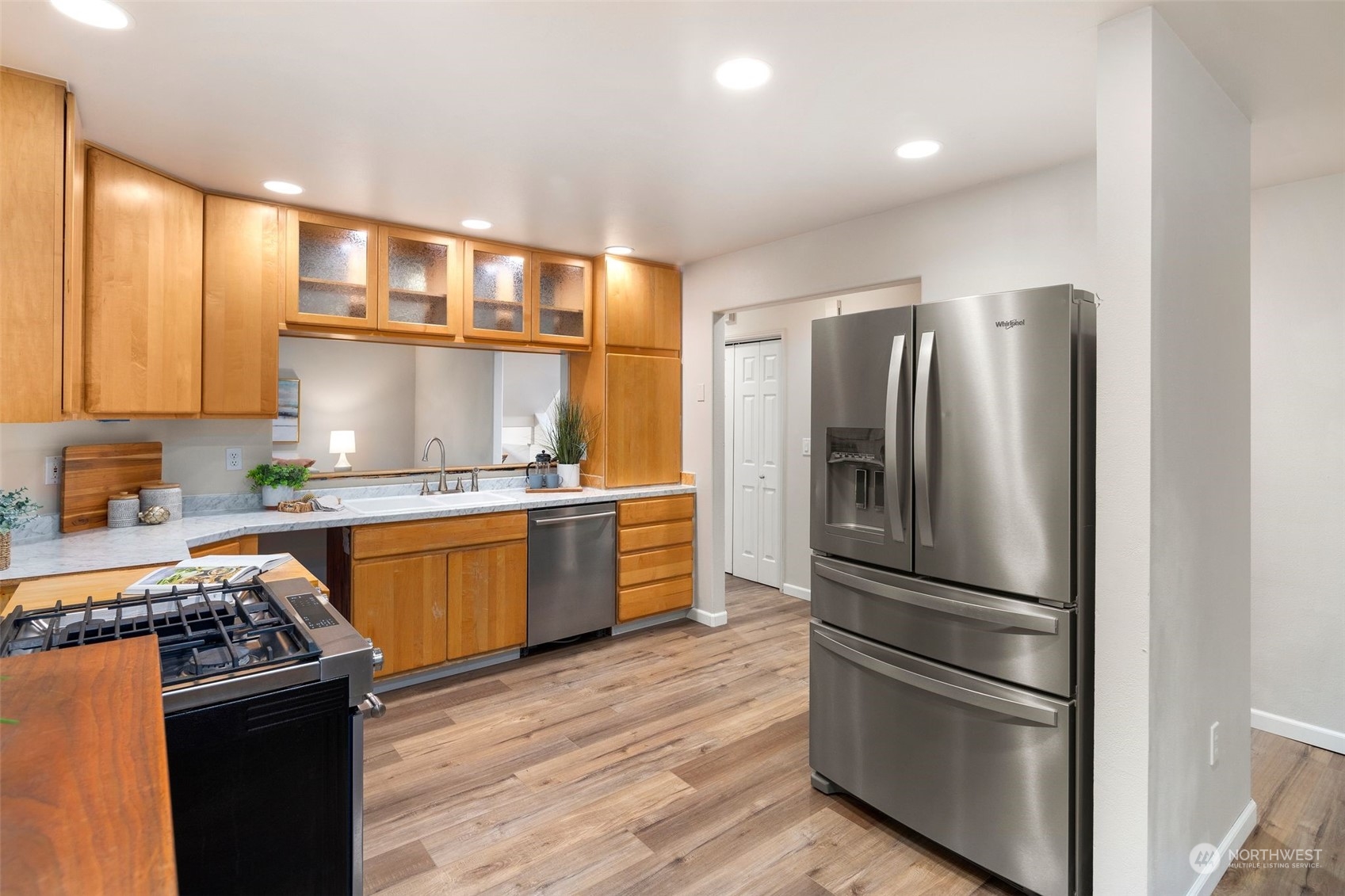 4729 Seahurst Avenue Everett, WA 98203 - Photo 11 of 40 a kitchen with granite countertop stainless steel appliances and wooden cabinets