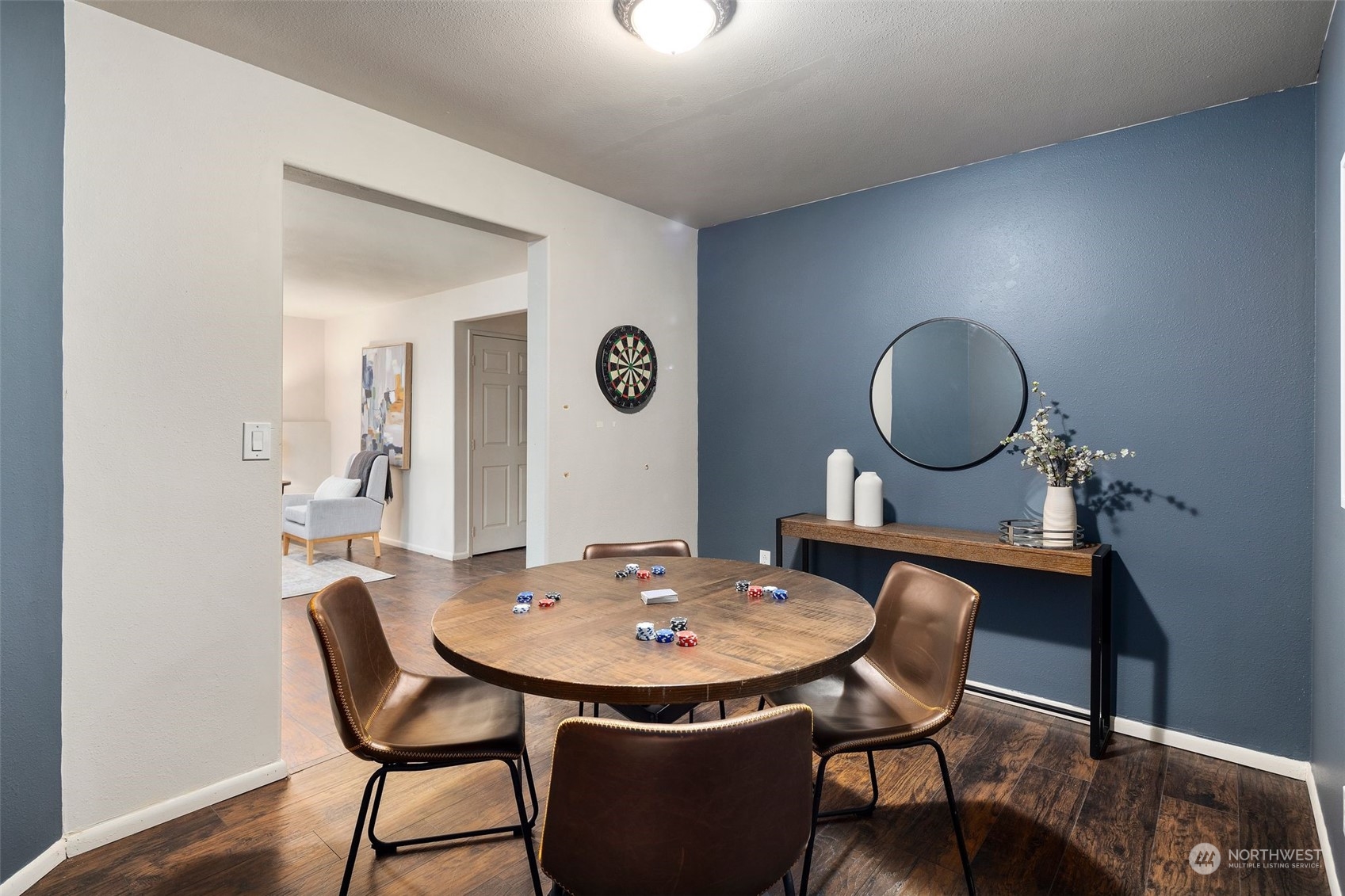 4729 Seahurst Avenue Everett, WA 98203 - Photo 19 of 40 a view of a dining room with furniture and wooden floor