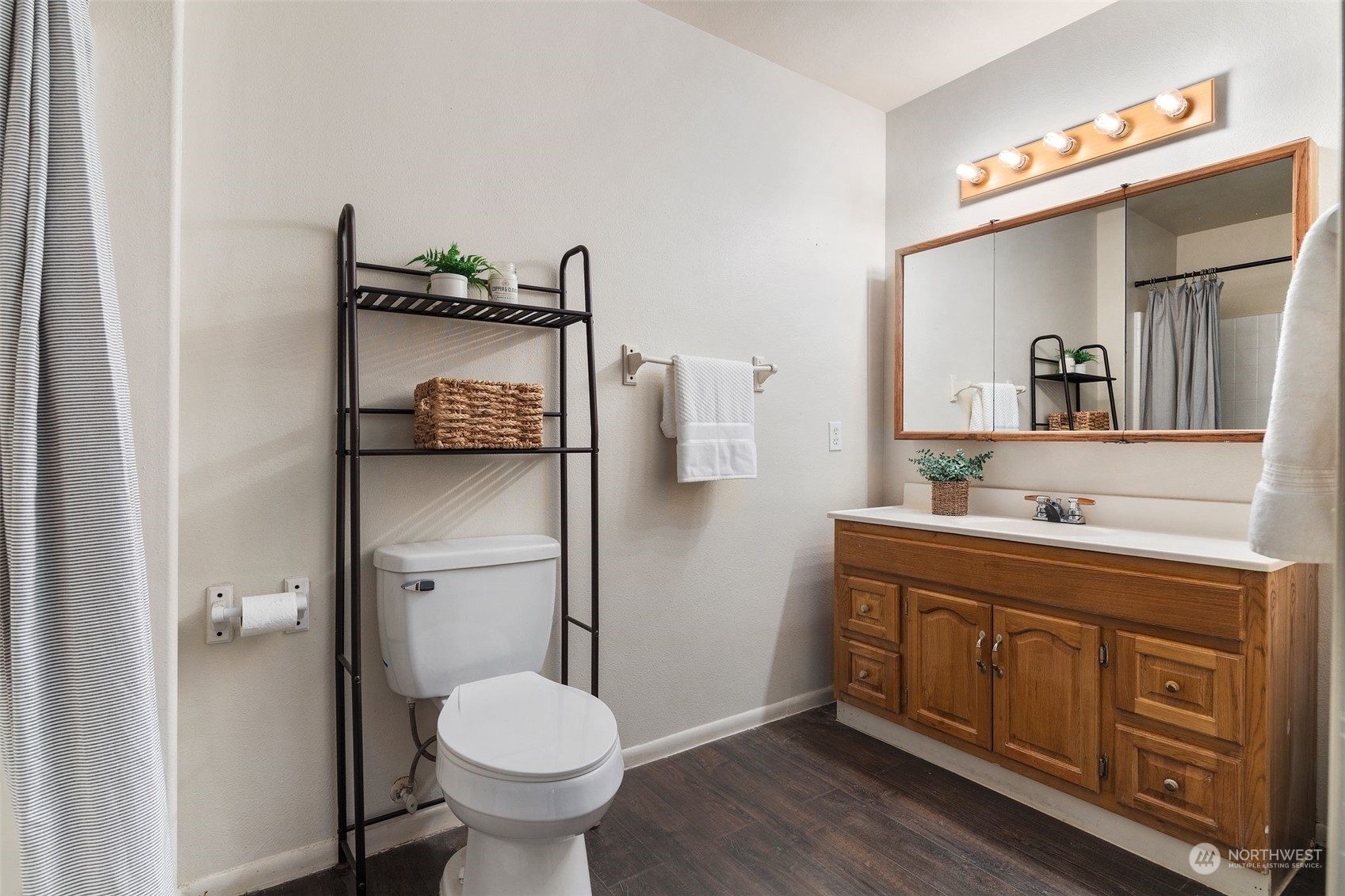 4729 Seahurst Avenue Everett, WA 98203 - Photo 23 of 40 a bathroom with a toilet sink and mirror