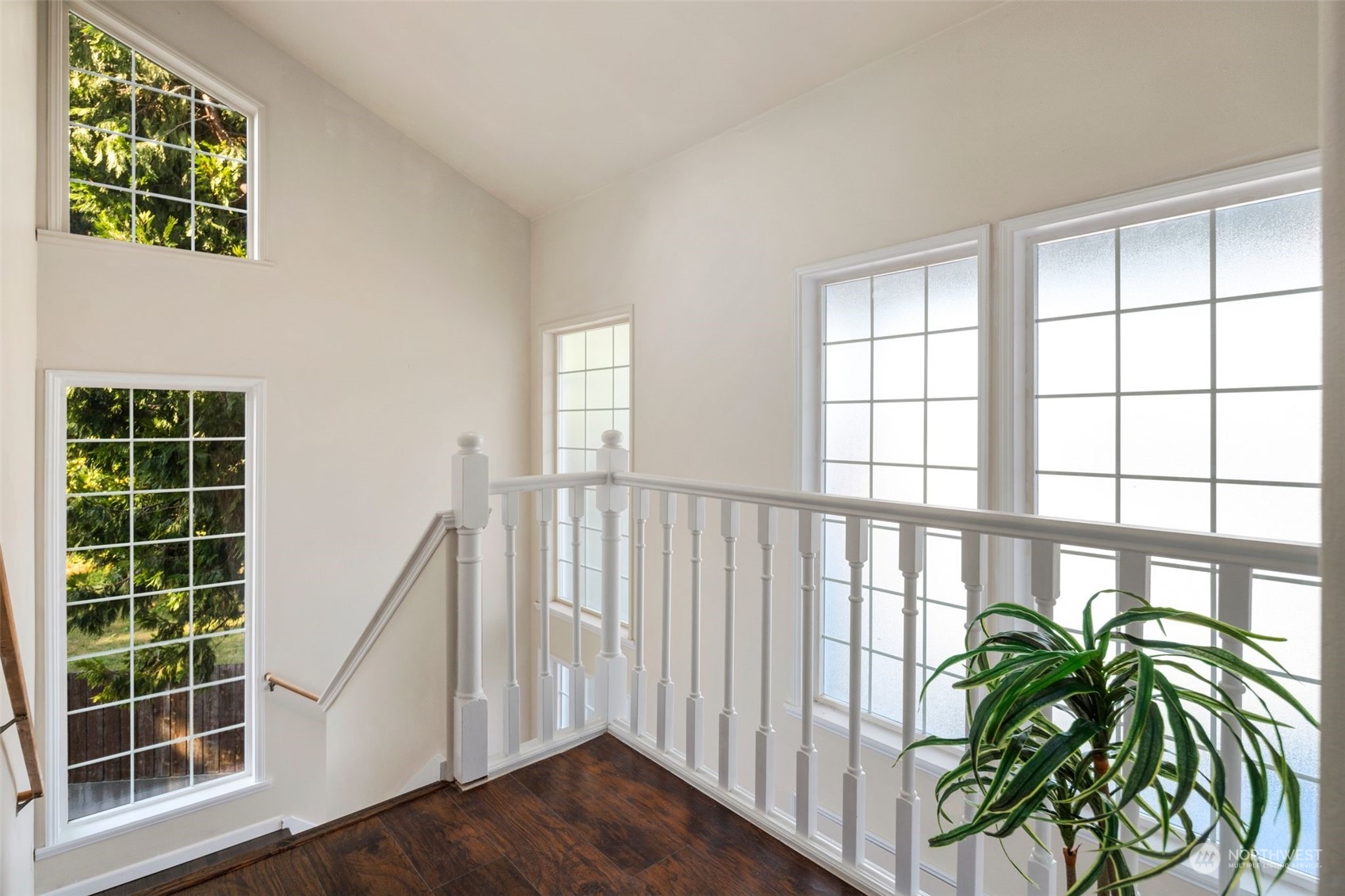 4729 Seahurst Avenue Everett, WA 98203 - Photo 26 of 40 a view of a porch with a floor to ceiling window and wooden floor