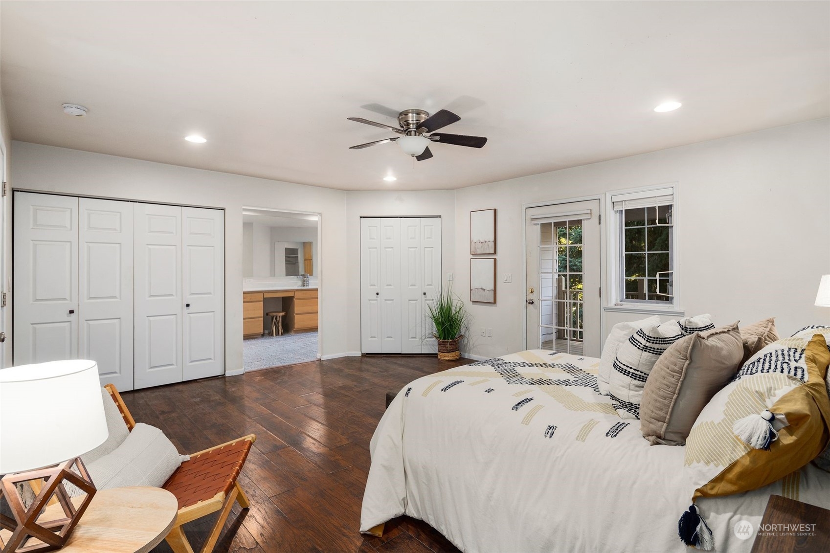 4729 Seahurst Avenue Everett, WA 98203 - Photo 28 of 40 a spacious bedroom with a bed a couch and furniture