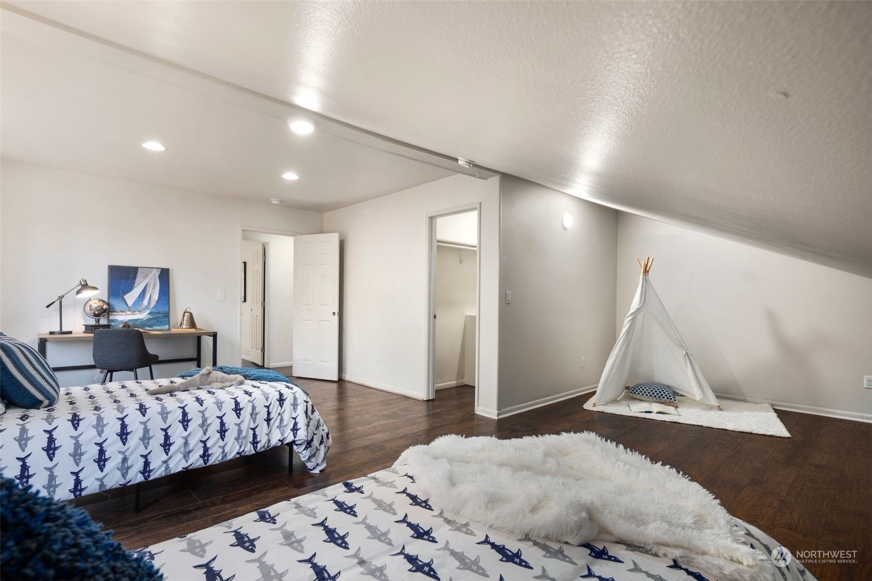 4729 Seahurst Avenue Everett, WA 98203 - Photo 33 of 40 a bedroom with a large bed and a couch